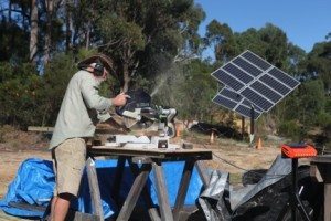 Colin Burgess at work installing the tracking solar panels.  Pic supplied.